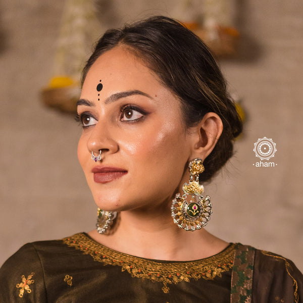 Statement Noori two tone chandbali earrings with green calcite centre. Handcrafted in 92.5 sterling silver with beautiful peacock stud. Perfect for special occasions and festivities.