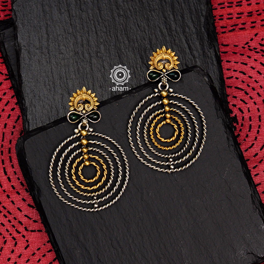 Noori two tone silver earrings crafted in 92.5 silver. Light weight with beautiful geometric concentric circles. Works perfect with your indo-western outfit. 