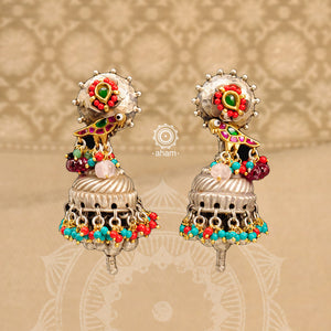 Statement Noori two tone jhumkie earrings in 92.5 sterling silver. Handcrafted including beautiful bird motif with semi precious beads. Style this up with your favourite ethnic or fusion outfit. The flower stud is detachable, and will work great with your minimalistic looks.
