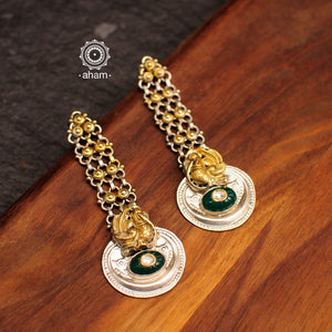 Long Noori two tone earrings with green semi precious stone. Handcrafted in 92.5 sterling silver with intricate peacock motif. Style this up with your favourite ethnic or fusion outfit.