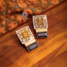 Noori two tone silver lapiz coloured stone earrings. Handcrafted in 92.5 sterling silver with kundan work. Style this elegant earrings with your favourite ethnic or fusion outfits to complete the look.