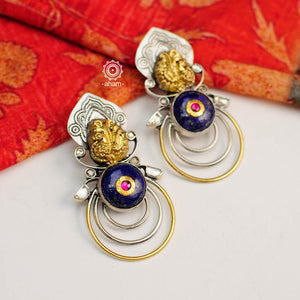Dual Tone Earrings crafted in 92.5 sterling silver with Nakshi work Peacock, Lapiz stone highlight and kundan highlights. These earrings are a perfect accent to compliment a minimal ensemble. 