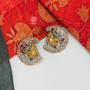 Noori two tone earrings with intricate floral work. Handcrafted in 92.5 sterling silver with Peacock motif and embellished cultured pearls. Style this up with your favourite ethnic or fusion outfit.