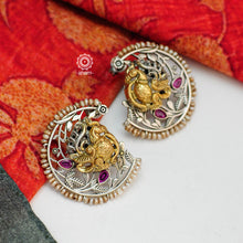 Noori two tone earrings with intricate floral work. Handcrafted in 92.5 sterling silver with Peacock motif and embellished cultured pearls. Style this up with your favourite ethnic or fusion outfit.