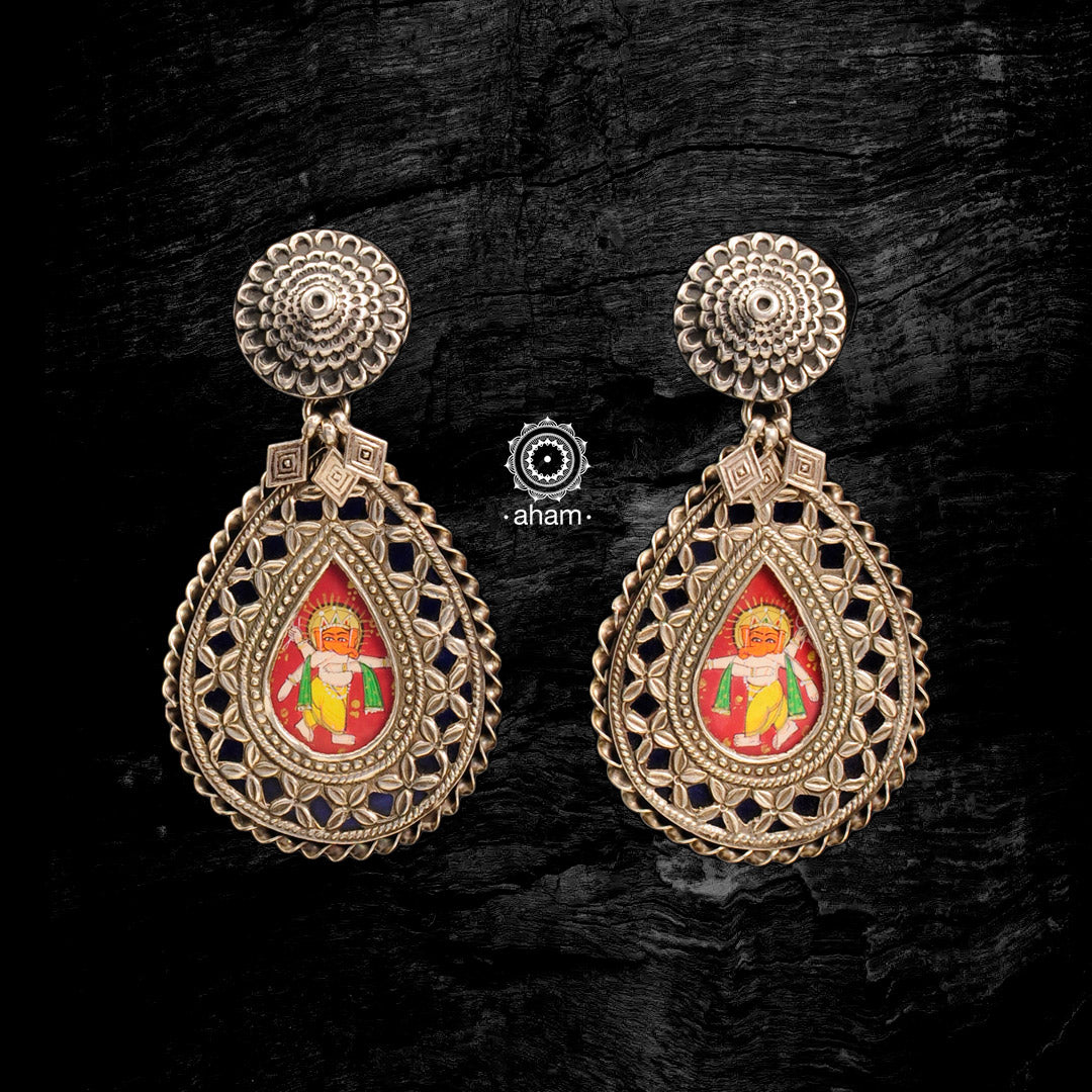 Light weight 92.5 silver earrings with intricate miniature hand painted lord Ganesha motif in vibrant colours, enclosed with a glass top.