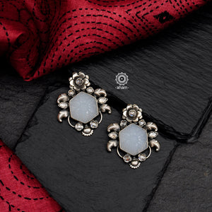 Handcrafted 92.5 sterling silver Ira earrings with flower craved on moonstone. Can be paired with both ethnic and western outfits. 