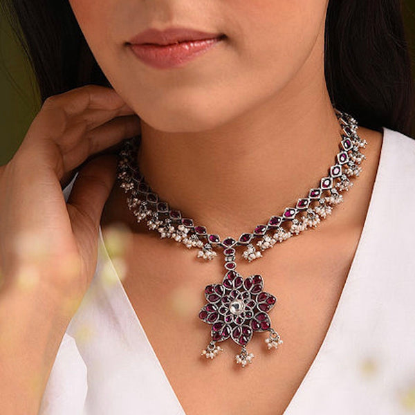 Nrityam 92.5 sterling silver flower neckpiece with maroon kemp stone setting and cultured pearls. Perfect for attending wedding ceremonies and special occasions.