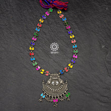 Vibrant Rang Mahal double peacock neckpiece. Handcrafted in 92.5 sterling silver with colourful glass foils enclosed in glass tops and an ark shaped pendant with intricate work. Pair this necklace with your plain kurta and suit sets to brighten up the look.