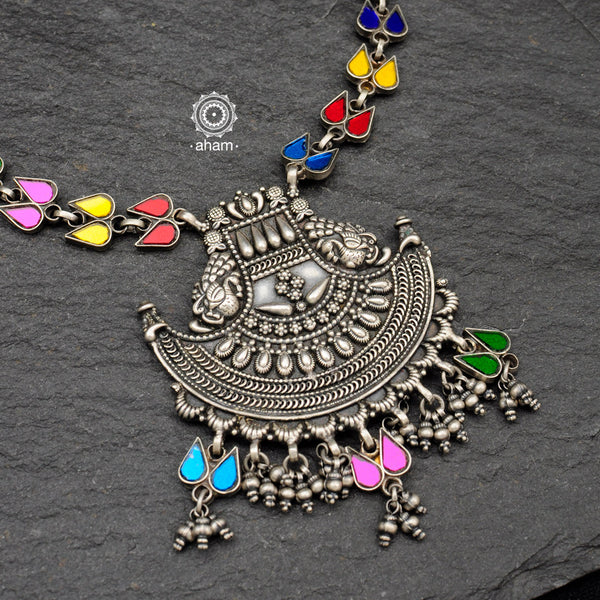Vibrant Rang Mahal double peacock neckpiece. Handcrafted in 92.5 sterling silver with colourful glass foils enclosed in glass tops and an ark shaped pendant with intricate work. Pair this necklace with your plain kurta and suit sets to brighten up the look.