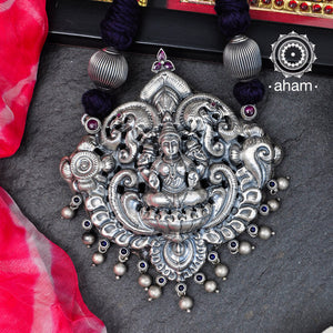 Statement Lakshmi Pendant in 92.5 sterling silver with cotton adjustable thread. Intricate Nakshi/ Naksahi work 3 d Idols, inspired from South Indian temple work. Created using Repoussé and chasing technique