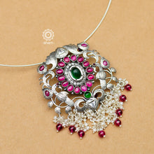 Flaunt this beautiful Nrityam hasli with elegant peacock motif pendant with dangling cultured pearls. Beautiful, handcrafted 92.5 sterling silver neckpiece with double peacock motif and intricate floral motif with green and maroon kemp stone setting. The pendant is removable you can also pair different pendants with this hasli.  