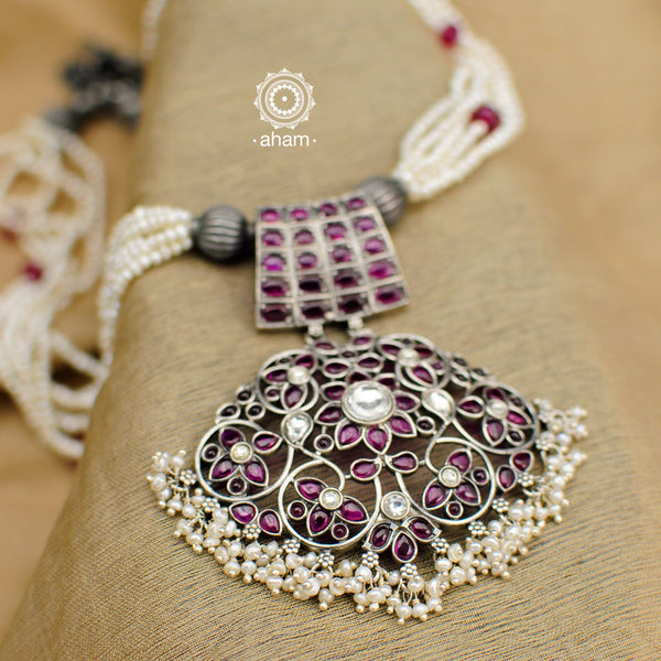 Make a sophisticated style statement this festive season in this nrityam neckpiece. Handcrafted in 92.5 sterling silver using traditional artistry with maroon Kemp stone setting. Perfect for intimate weddings and upcoming festive celebrations. 