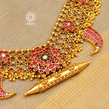 Handcrafted tiger claw neckpiece with an amulet pendant in the centre. Created using traditional techniques in 92.5 sterling silver with gold polish, rani (pink) coloured floral motifs and ghungroos. Perfect for intimate weddings and upcoming festive celebrations.