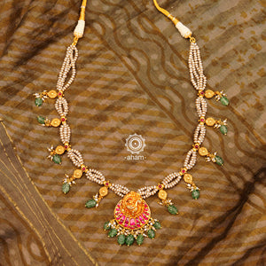 Festive peacock neckpiece with gold polish beads and elegant cultured pearl mala. Handcrafted in silver with green semi precious beads, rani pink kundan work. Lightweight and elegant necklace perfect for family functions and special occasions. 