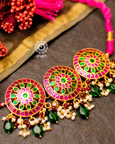 Beautiful gold polish flower choker with green & pink kundan work. Handcrafted 92.5 sterling silver with semi precious beads and dangling cultured pearls. Pair this neckpiece with your ethnic outfits this festive season to complete the look.