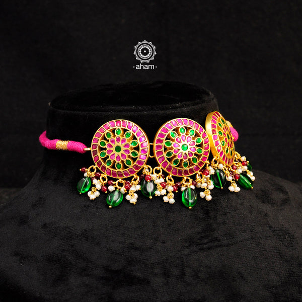 Beautiful gold polish flower choker with green & pink kundan work. Handcrafted 92.5 sterling silver with semi precious beads and dangling cultured pearls. Pair this neckpiece with your ethnic outfits this festive season to complete the look.