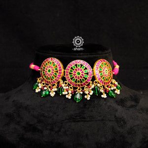 Beautiful gold polish flower choker with green & pink kundan work. Handcrafted 92.5 sterling silver with semi precious beads and dangling cultured pearls. Pair this neckpiece with your ethnic outfits this festive season to complete the look.