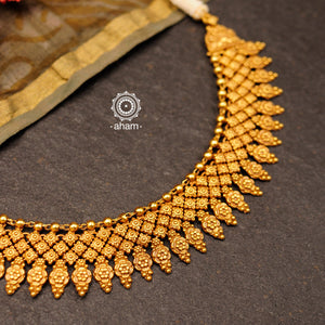  Gold polish neckpiece with intricate floral patterns. Handcrafted in 92.5 sterling silver using traditional techniques. Perfect for intimate weddings and upcoming festive celebrations.
