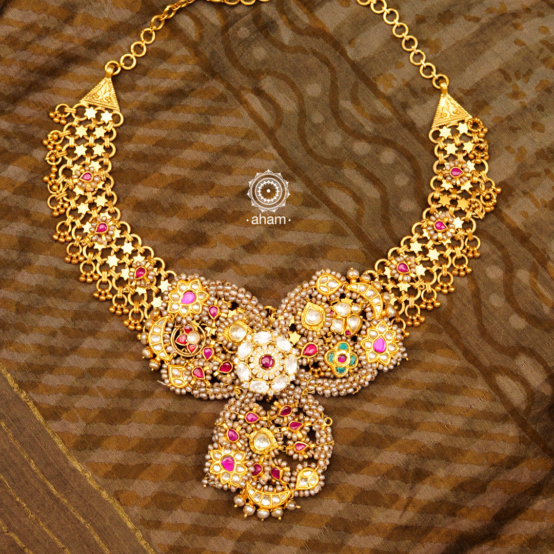 Inspired from the Traditional Nath design, this gorgeous neckpiece is an amalgamation of beautiful kundan and pearls coming together. Crafted in 92.5 silver with gold polish, the neckpiece is perfect for weddings and festivals. 