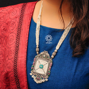 Handcrafted 92.5 sterling silver cultured pearl neckpiece with green and maroon kemp stone setting. The Pendant has unique intricate floral motifs, double parrot motif and turquoise stone.