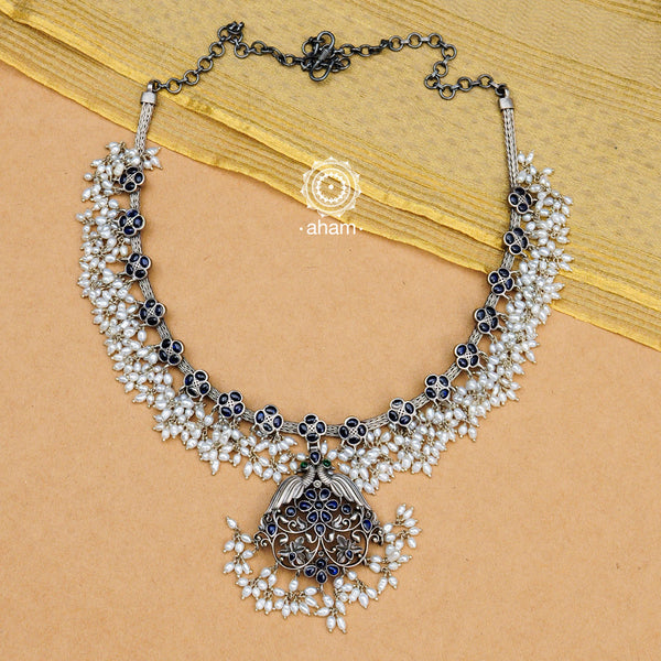 Beautiful handcrafted 92.5 sterling silver Guttapusalu style neckpiece.    Gutta in Telugu means “Shoals of small fish”, and Pusalu means “beads”. Set in a melange of kundan, green and kemp stones fringed with bunches of small pearls, the Guttapusalu are a most have in every jewellery lovers collection. These are timeless pieces for generations to come.