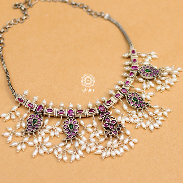 Beautiful handcrafted two sided Guttapusalu style short neckpiece. Created in 92.5 sterling silver paisley necklace with green and maroon Kemp stone setting.    Gutta in Telugu means “Shoals of small fish”, and Pusalu means “beads”. Set in a melange of kundan, green and kemp stones fringed with bunches of small pearls, the Guttapusalu are a most have in every jewellery lovers collection. These are timeless pieces for generations to come.