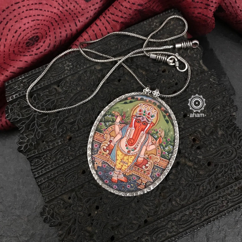 Hand painted silver Ganesha pendant.  Intricate miniature painting work done by skilful artisans to create these beautiful wearable art pieces. 