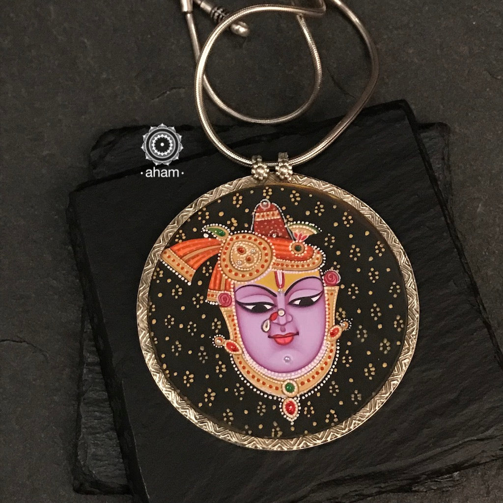 Handpainted silver Shrinathji Krishna pendant. Intricate miniature painting work done by skilful artisans to create these beautiful wearable art pieces. 
