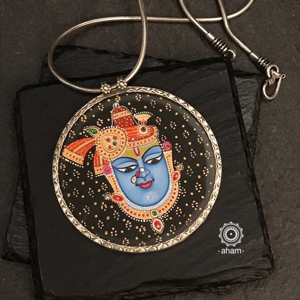 Handpainted silver Shrinathji Krishna pendant. Intricate miniature painting work done by skilful artisans to create these beautiful wearable art pieces. 