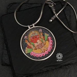 Hand painted silver Ganesha pendant. Intricate miniature painting work done by skilful artisans to create these beautiful wearable art pieces. 