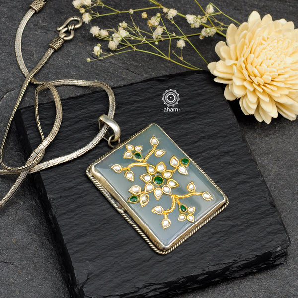 Handmade pendant with Mughal Inspired intricate floral inlay work in semi precious stone setting, encased in silver. Wear it long or short with a chain of your choice, or a smart silver Hasli. A piece so timeless that it can we worn across generations.  Please note, each piece created in this series is unique and one of a kind. 