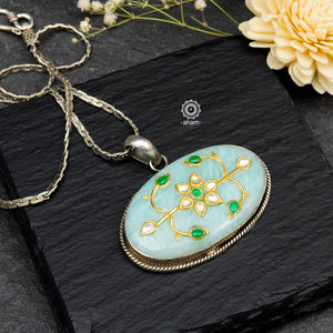 Handmade pendant with Mughal Inspired intricate floral inlay work in semi precious stone setting, encased in silver. Wear it long or short with a chain of your choice, or a smart silver Hasli. A piece so timeless that it can we worn across generations.  Please note, each piece created in this series is unique and one of a kind. 