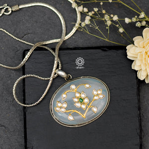 Handmade pendant with Mughal Inspired intricate floral inlay work in semi precious stone setting, encased in silver. Wear it long or short with a chain of your choice, or a smart silver Hasli. A piece so timeless that it can we worn across generations.  Please note, each piece created in this series is unique and one of a kind. 