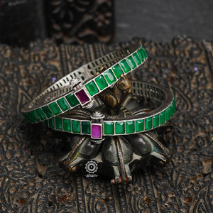 South Indian traditional handcrafted 92.5 sterling silver bangles with green spinel stones. Classic styles that never fade with time. 