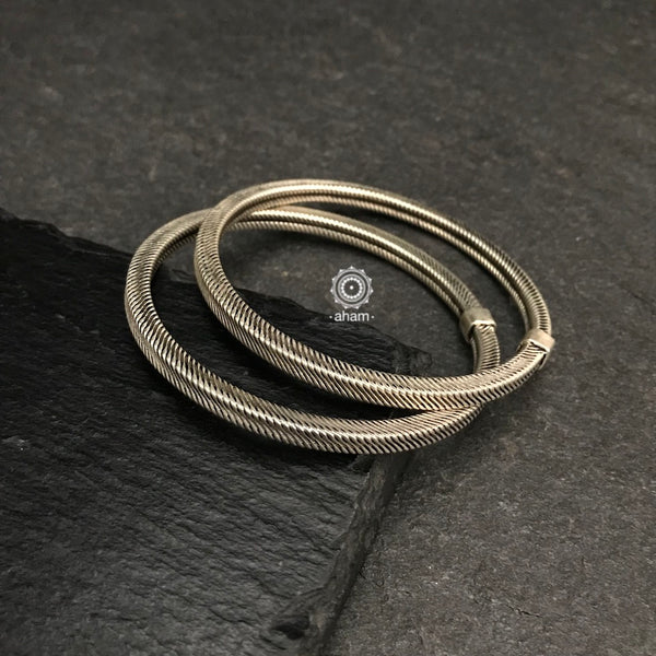 Handcrafted everyday wear bangles textured in 92.5 sterling silver.