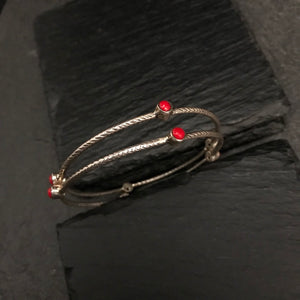 Handcrafted Summer Love bangles in 92.5 sterling silver with coral coloured stone highlights. Perfect everyday wear you can stack them or wear them alone. 