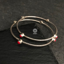 Handcrafted Summer Love bangles in 92.5 sterling silver with coral coloured stone highlights. Perfect everyday wear you can stack them or wear them alone. 