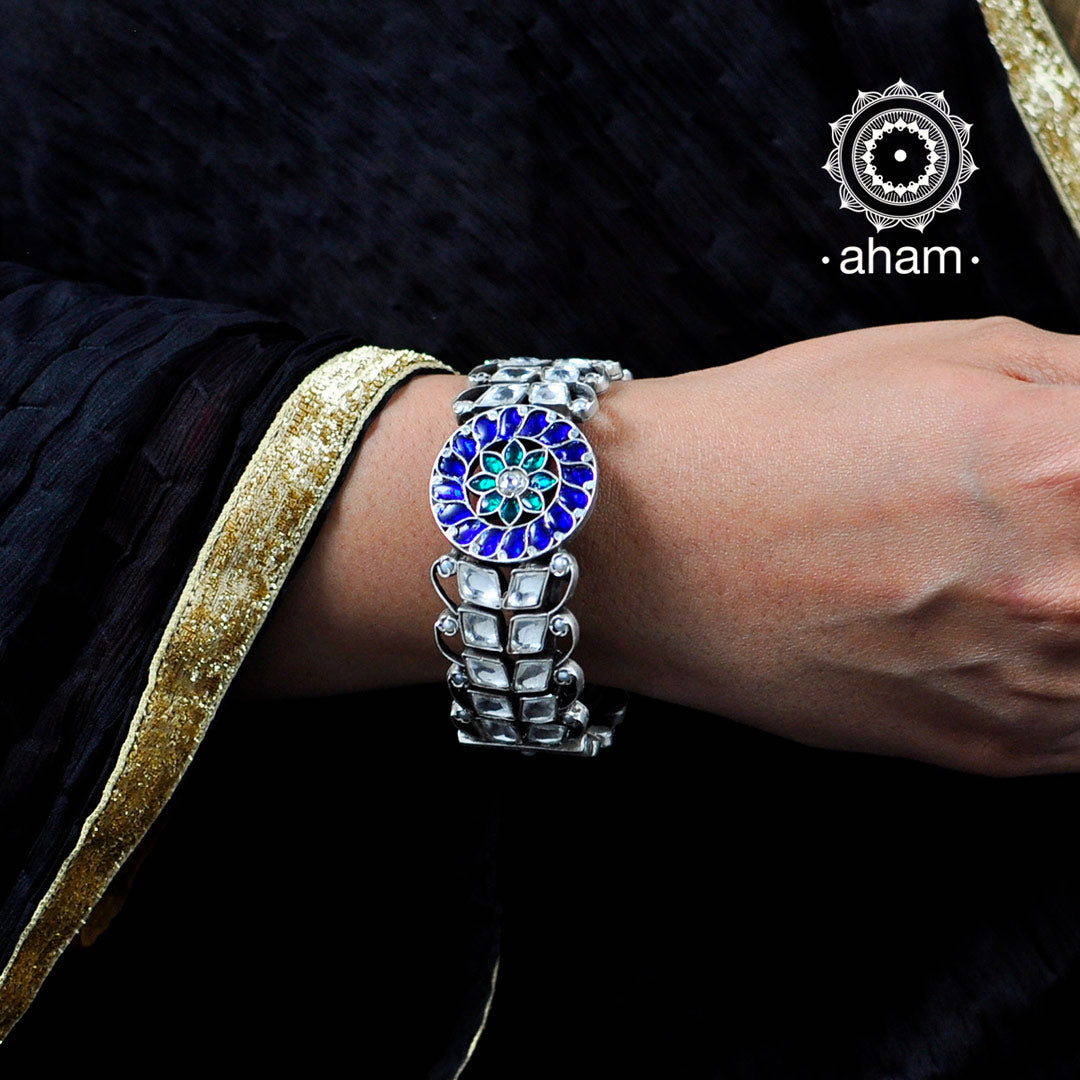 Titan - Diamonds and enamel work come together upon a stunning gold Kada  and an imprinted white dial, telling the tale of majestic Deccan armoury;  this timepiece marks the beauty of your