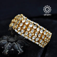 Handcrafted festive gold polish bracelet in 92.5 sterling silver with kundan work and embellished cultured pearls.