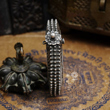 Statement vintage silver kada with intricate floral work, handcrafted by skilful artisans. Beautiful piece from a bygone era, that bring back memories and stories of that time.  