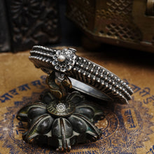 Statement vintage silver kada with intricate floral work, handcrafted by skilful artisans. Beautiful piece from a bygone era, that bring back memories and stories of that time.  
