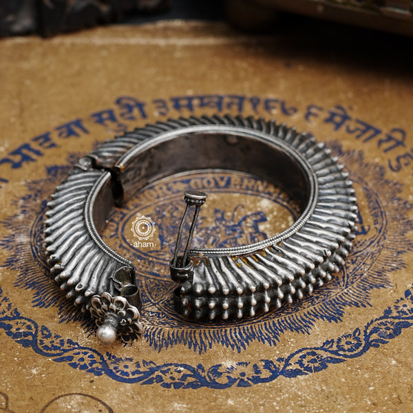 Statement vintage silver kada with intricate floral work, handcrafted by skilful artisans. Beautiful piece from a bygone era, that bring back memories and stories of that time.  