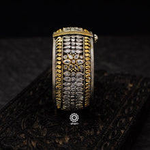 Noori two tone hand kada with zircon stone setting. Handcrafted in 92.5 sterling silver with intricate paisley motifs. 