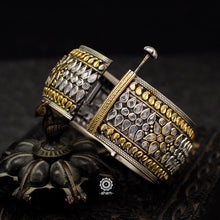 Noori two tone hand kada with zircon stone setting. Handcrafted in 92.5 sterling silver with intricate paisley motifs. 