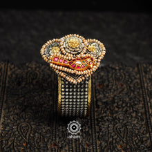 Noori two tone silver open hand cuff with a vibrant bird motif. An eclectic mix of elements, with a play of colours, textures, forms and workmanship. Handcrafted in 92.5 sterling silver with dual tones that make them so versatile and unique. Modern Heirloom pieces that can be worn across generations. 