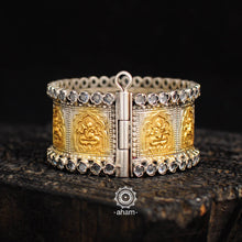 Silver two tone kada with Ganesha motif and Zircon highlights.  Silver hand kada with two tone gold polish. 