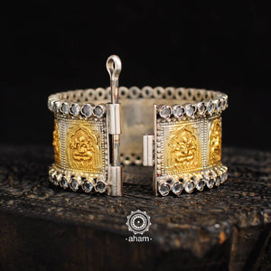 Silver two tone kada with Ganesha motif and Zircon highlights.  Silver hand kada with two tone gold polish. 