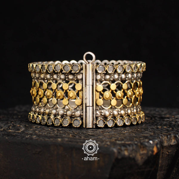 One of a kind statement wearable art pieces. Silver hand kada with two tone gold polish 