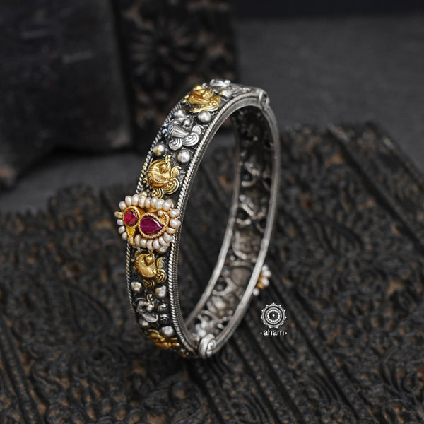 Noori two tone hand kada handcrafted in 92.5 sterling silver with intricate floral work. The beauty of two tone jewellery pieces is that they are so versatile, they can be clubbed and styled with so many outfits, including your Indian and Western wear.