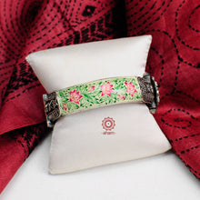 Beautiful 92.5 sterling silver kada with Meenakari work. Miniature floral hand painting done by skilful artisans. These elegant kadas are a must have in any jewellery lovers collection. 